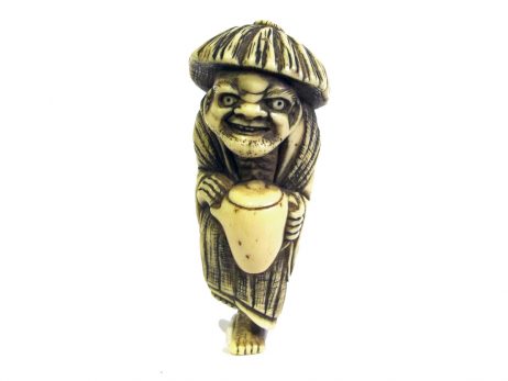 Netsuke en ivoire représentant la légende du voleur d'huile avec tada mori