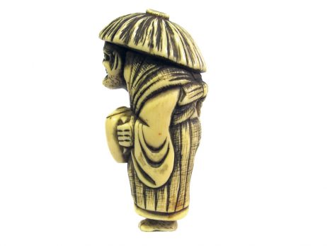 Netsuke en ivoire représentant la légende du voleur d'huile avec tada mori, edo